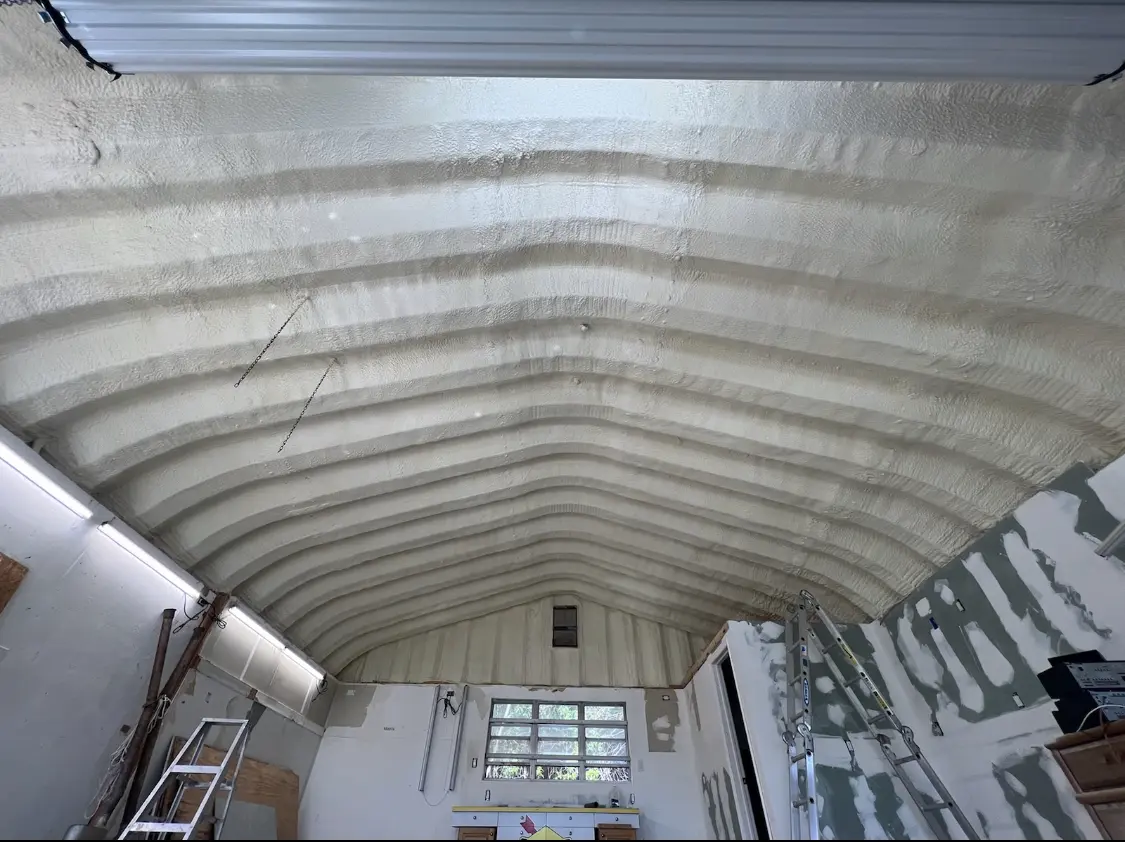 Spray polyurethane foam applied to the underside of a metal roof deck in Big Flats